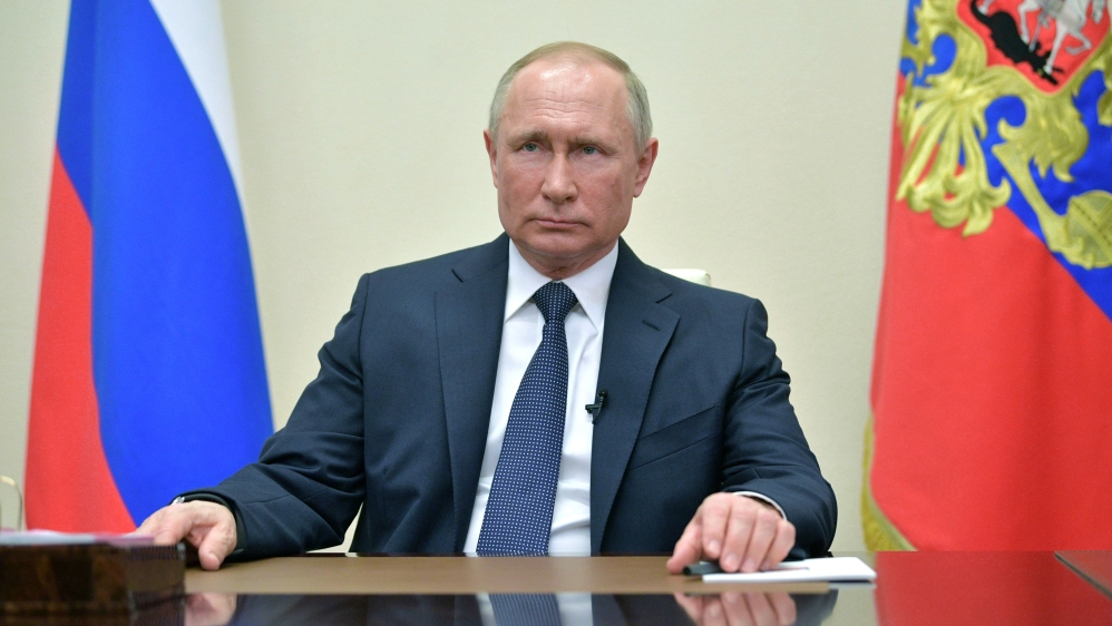 Russian President Putin delivers a televised address to the nation about the coronavirus disease outbreak, outside Moscow