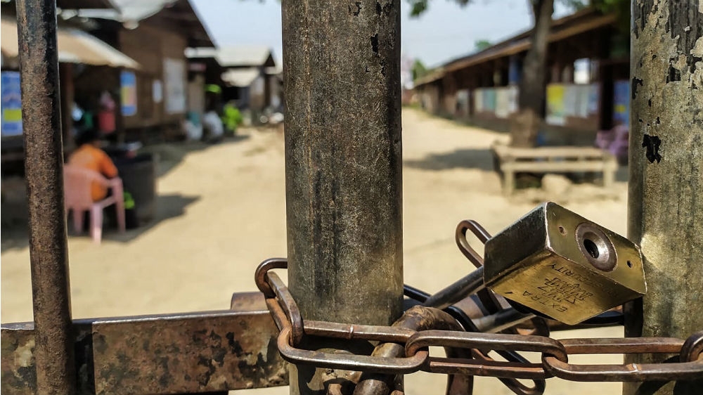 The padlocked gate of the Zilun camp for internally-displaced people as it was locked own on April 8 to protect people from coronavirus