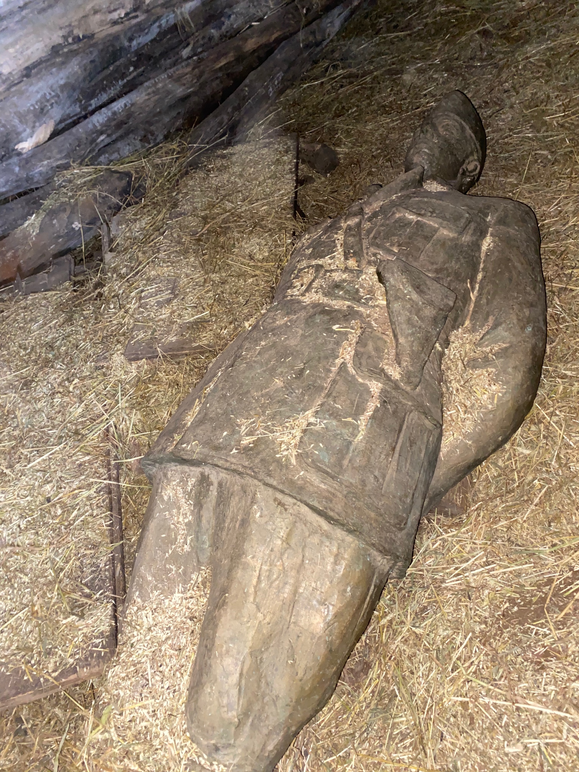 The statue of Hoxha lying in the basement of the former museum house in Labinot