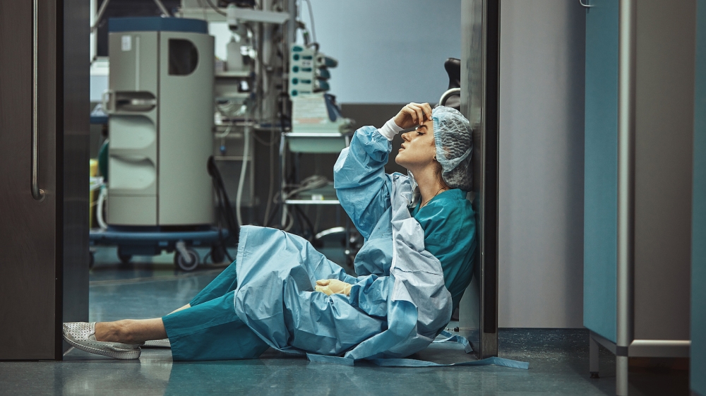 Woman surgeon looking sadness fatigue after surgery copyspace stress depression guilt unhappy problem worker medicine healthcare emotions.