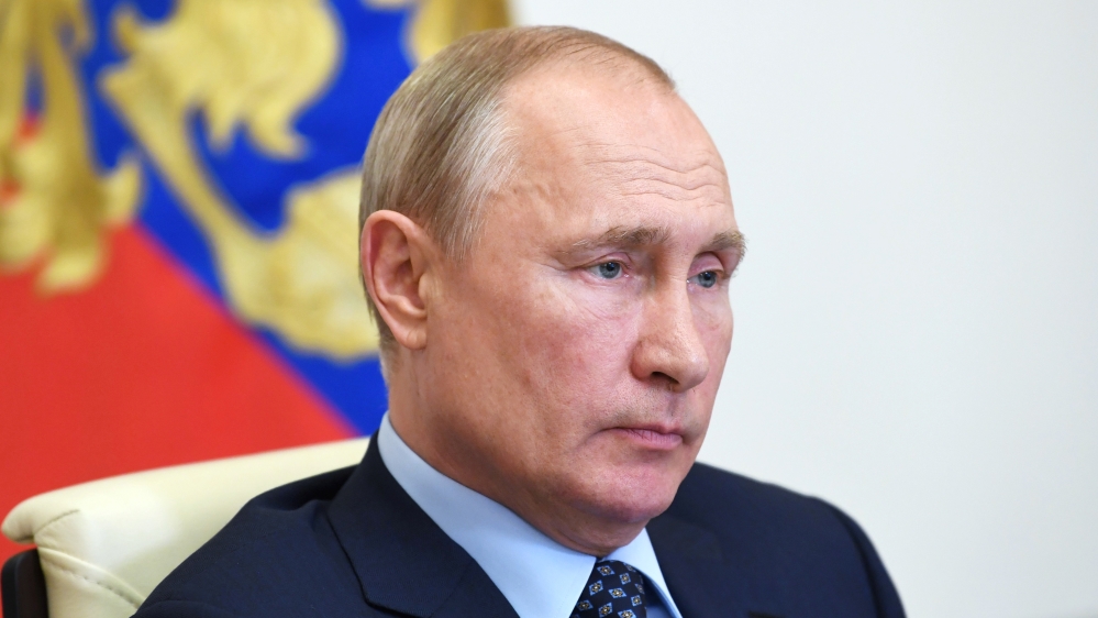 Russian President Putin delivers a televised address to the nation about the coronavirus disease outbreak, outside Moscow