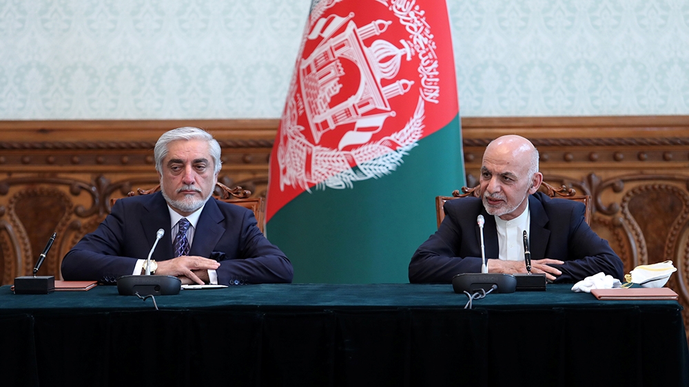 Afghanistan''s President Ashraf Ghani and his rival Abdullah Abdullah attend a ceremony to sign a political agreement in Kabul, Afghanistan May 17, 2020. Afghan Presidential Palace/Handout via REUTERS
