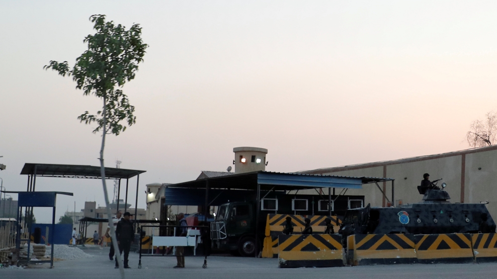 Security and police vehicles guard Cairo''s Tora prison, where the trial of ousted Egyptian Islamist President Mohamed Mursi took place, in Cairo
