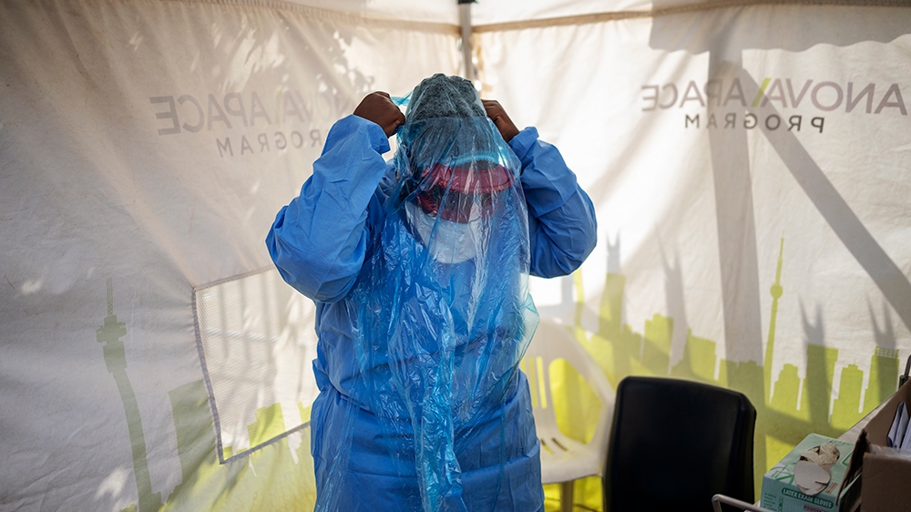 Doctors Without Borders (MSF) nurse Bhelekazi Mdlalose, 51, prepares herself to perform a swab test for COVID-19 coronavirus on health workers at the Vlakfontein Clinic in Lenasia, Johannesburg, on Ma