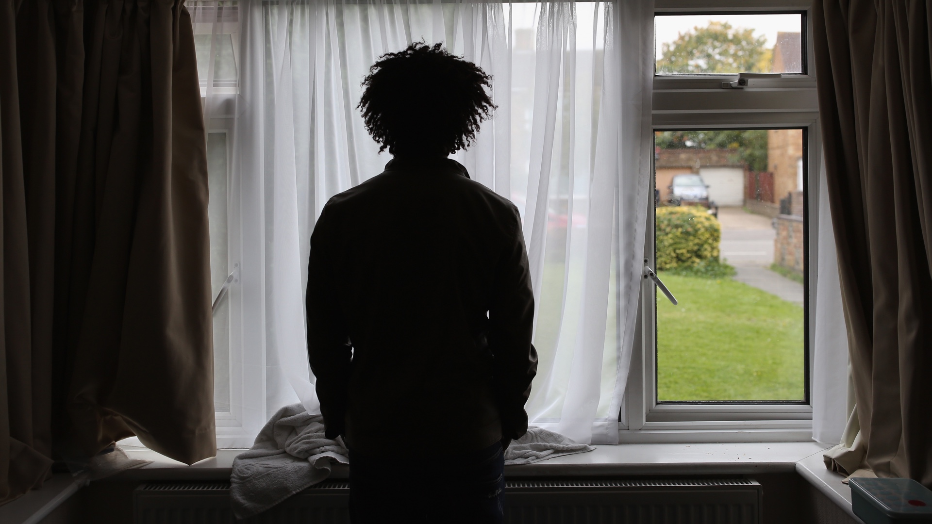 An asylum seeker inside his single room accommodation in Longford, England