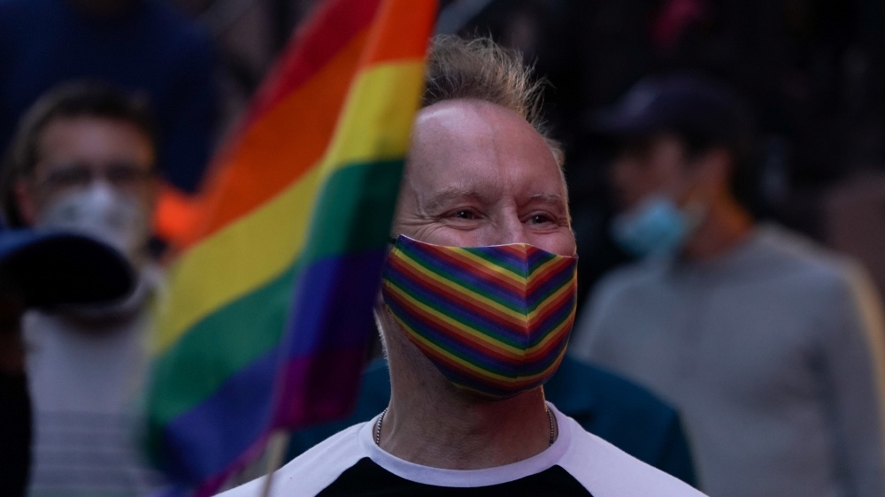 A man attends a rally at the Stonewall Inn to support the Supreme Court decision to uphold LBGTQ+ workplace rights in New York, US, June 15, 2020