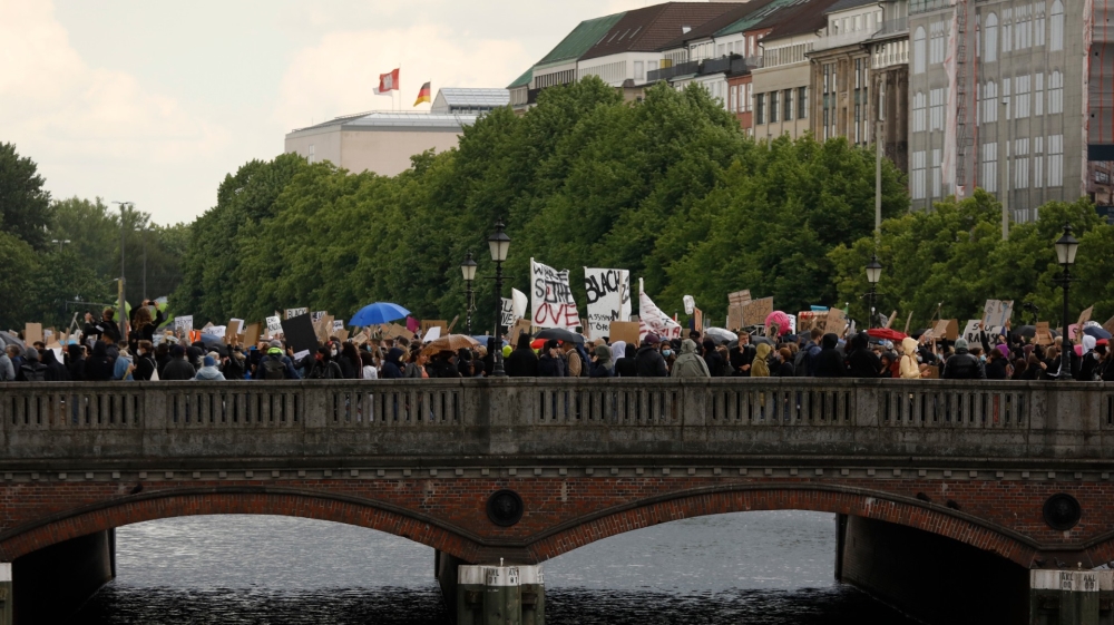 People take part in a silent protest in Hamburg, northern Germany, in solidarity with protests raging across the US over the death of George Floyd
