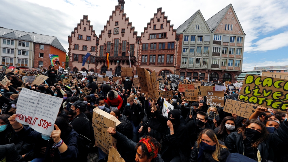 Demonstrators attend a protest against police brutality and the death in Minneapolis police custody of George Floyd, in Frankfurt, Germany