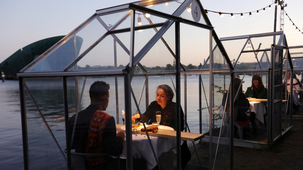 Models and family members are seen dining at a restaurant where they test servers providing drinks and food to models pretending to be clients in a safe 