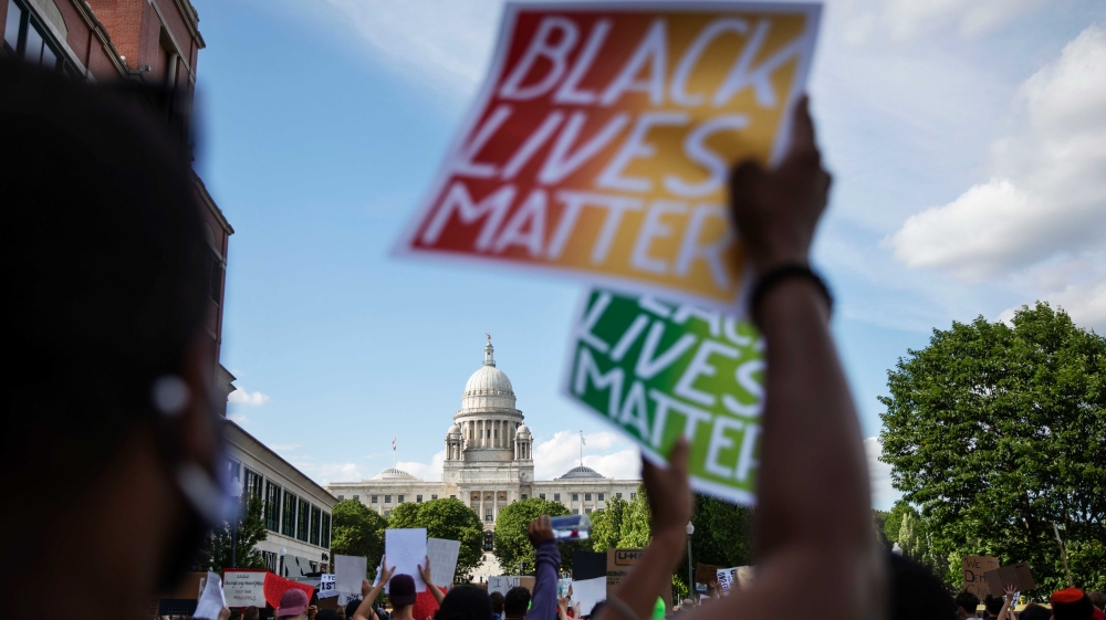 Protesters march to the Statehouse as part of a Juneteenth demonstration in Providence, Rhode Island
