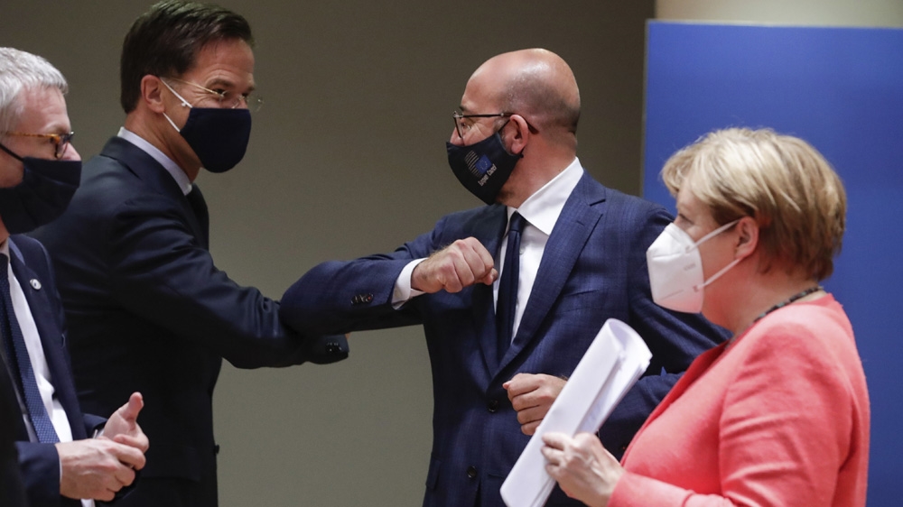 Dutch PM Mark Rutte, centre left, with European Council President Charles Michel, centre right, and German Chancellor Angela Merkel, right, as EU leaders met to thrash out a plan to help economies ravaged by the coronavirus