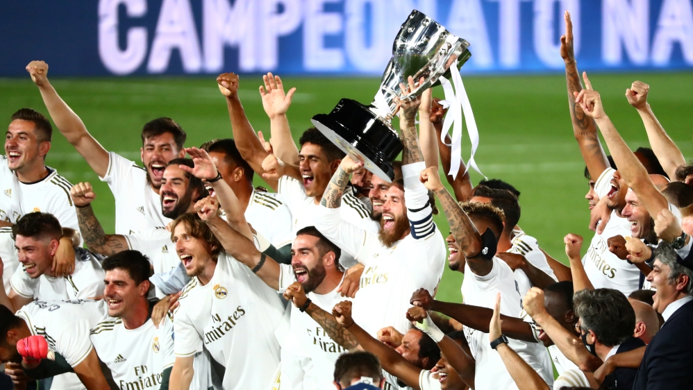 Real Madrid captain Sergio Ramos and teammates celebrate with the trophy