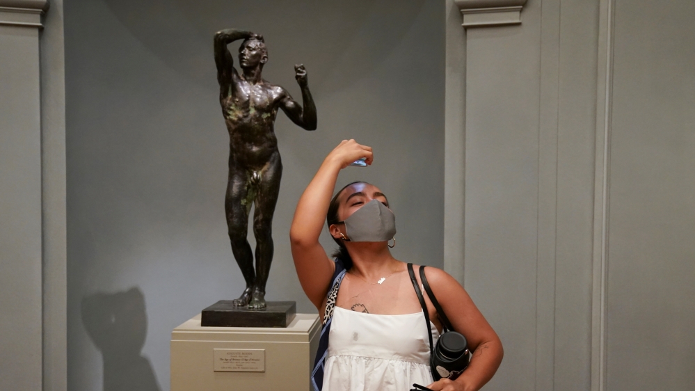 Mariana Martinez imitates a statue while making a birthday visit to the West Building of the National Gallery of Art, in Washington,D.C.