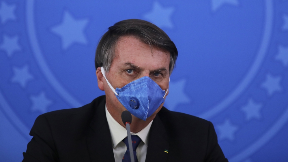 Brazil''s President Jair Bolsonaro wears a face mask during a press conference on the coronavirus pandemic COVID-19 at the Planalto Palace in Brasilia, Brazil. Brazilian President Jair Bolsonaro announ