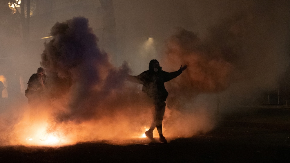 Federal law enforcement officers deployed under the Trump administration''s executive order face off with protesters