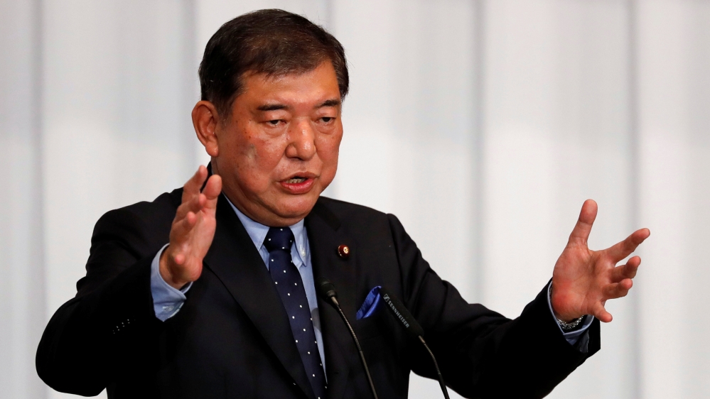 Japan's ex-defence minister Shigeru Ishiba delivers a speech during a meeting on the LDP party leader election at the party's headquarters in Tokyo
