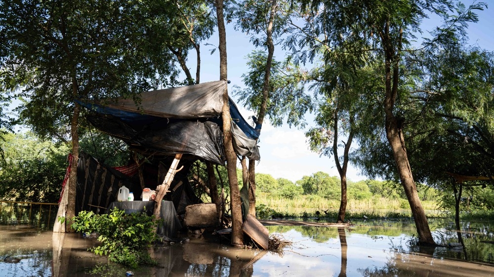 An abandoned kitchen is seen on the banks of the River Grande