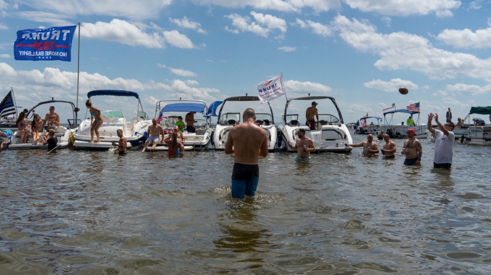“MAGA boaters” rally for President Donald Trump while parked at Three Mile Bay on Oneida Lake in upstate New York