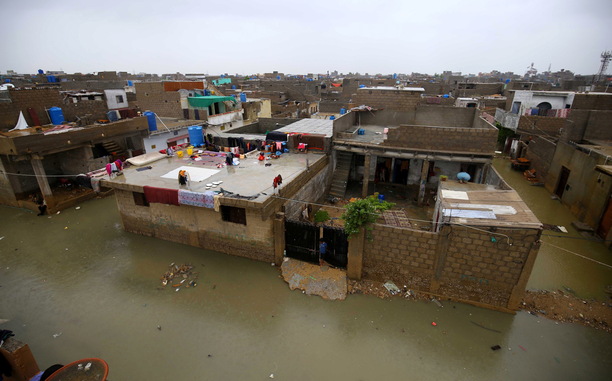 epa08624497 A view of inundated residential area after heavy monsoon rain water in Karachi, Pakistan, 25 August 2020. Heavy monsoon rain flooded several areas of Karachi causing traffic jams and power