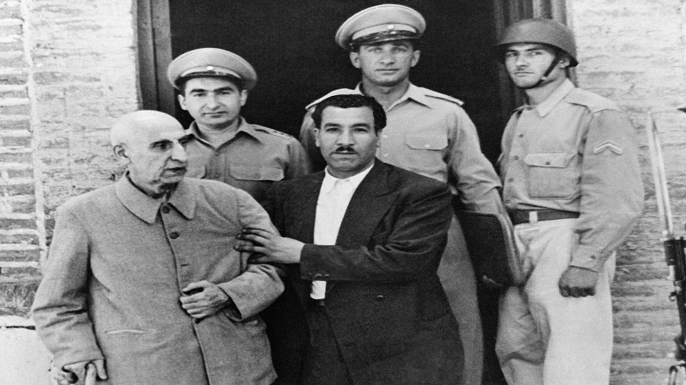 Mohammed Mossadegh is helped to a car on being released in August 1956 after three years of imprisonment on treason charges