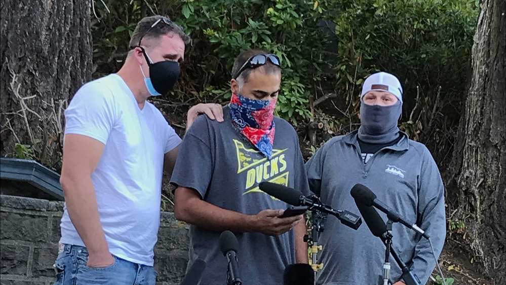 Luke Carrillo, centre, speaking about Aaron Danielson at a news conference in Portland, Oregon
