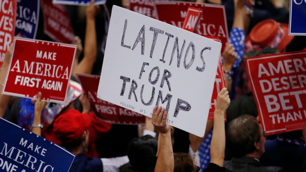 A person holds a sign reading Latinos for Trump on the third day of the Republican National Convention in Cleveland in 2016.
