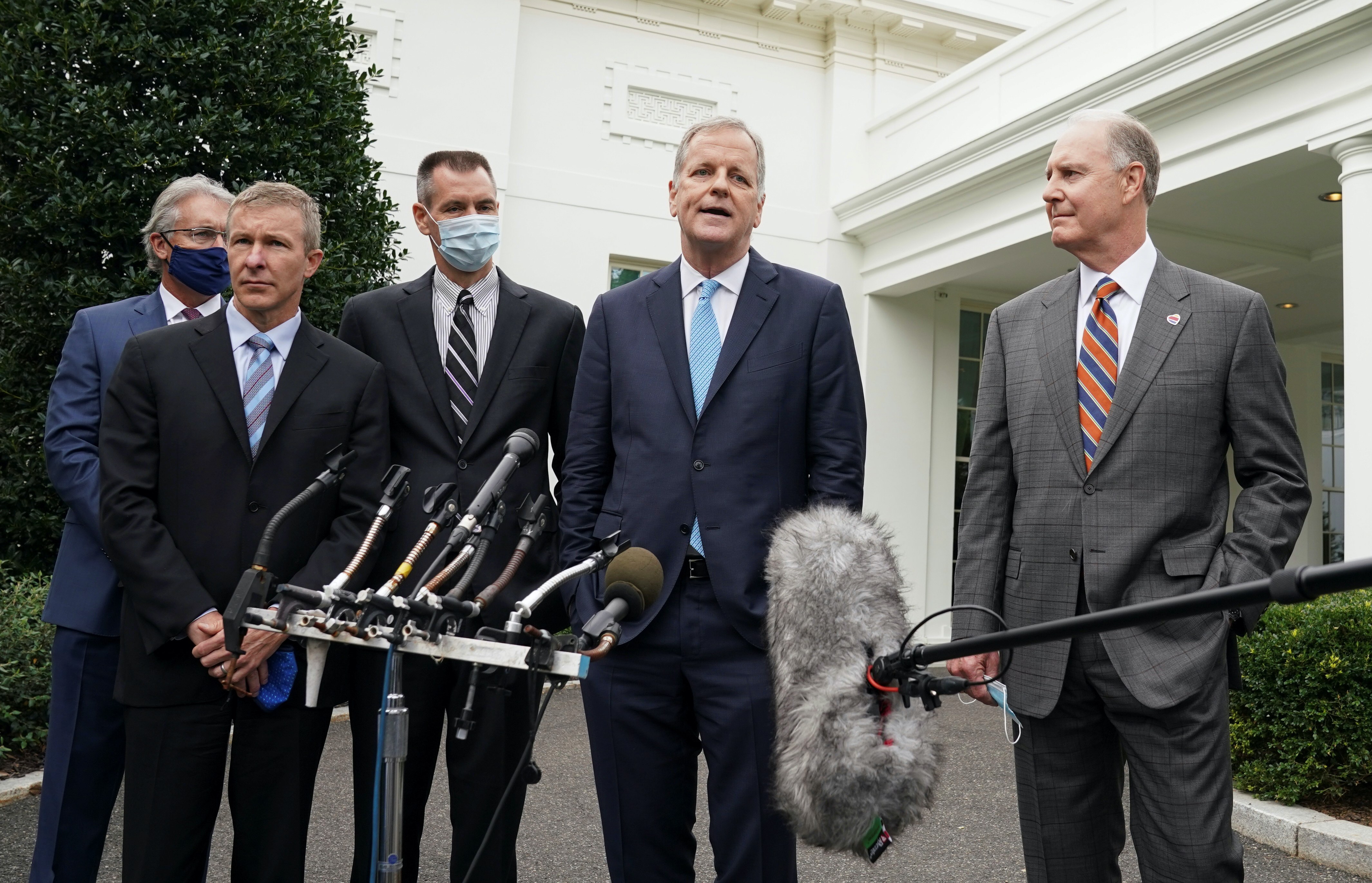 Flanked by other airline executives, American Airlines CEO Doug Parker speaks to reporters after meeting with White House Chief of Staff Mark Meadows in Washington, United States