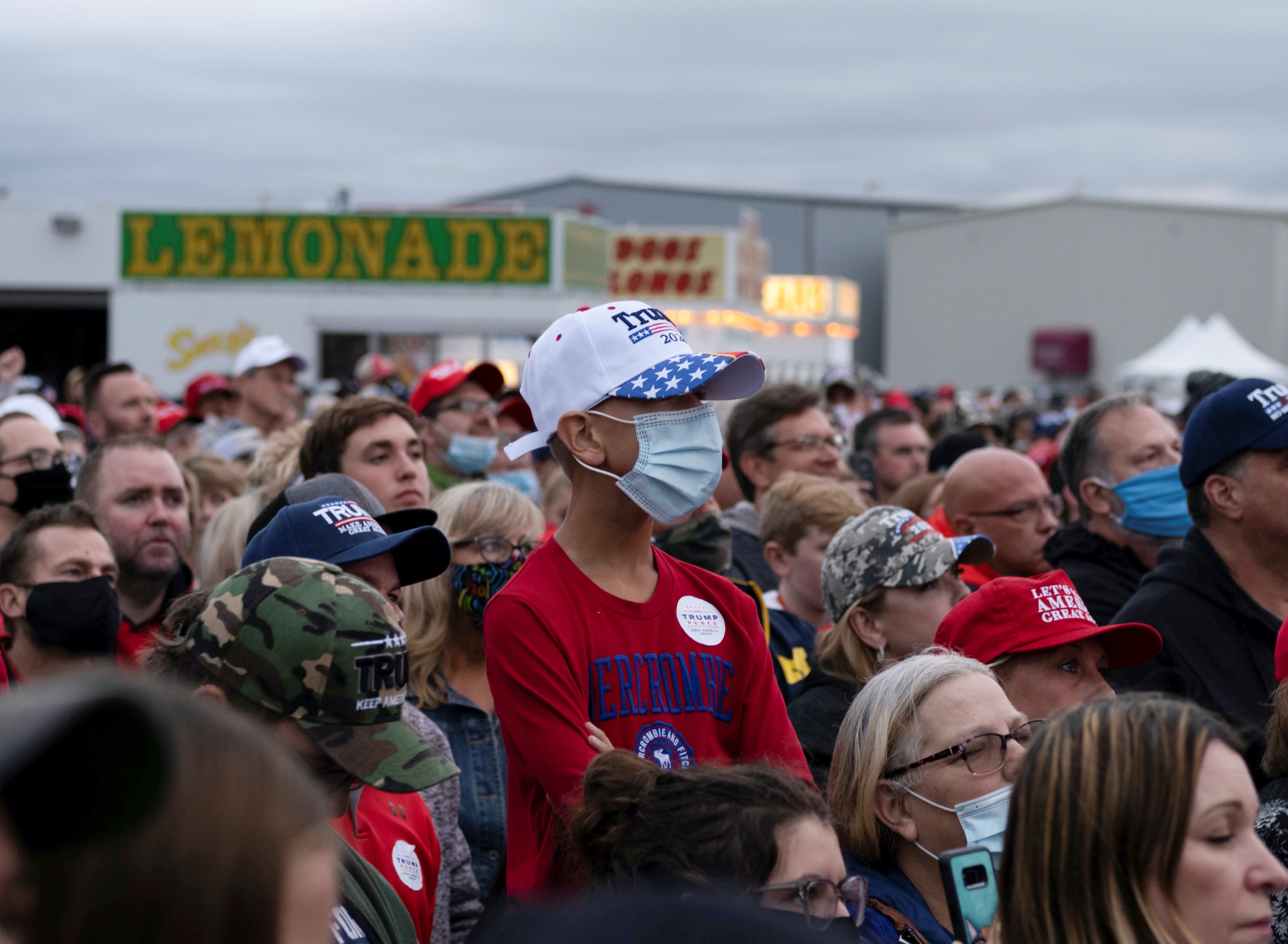 Supporters of US President Donald Trump attend a campaign event in Saginaw, Michigan