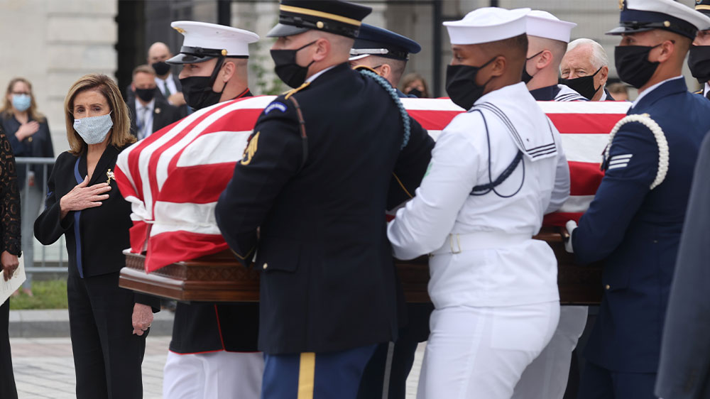 Speaker of the House Nancy Pelosi looks on as the casket of the late Supreme Court Associate Justice Ruth Bader Ginsburg is carried following ceremonies honouring Ginsburg at the US Capitol in Washington, DC, on September 25, 2020.