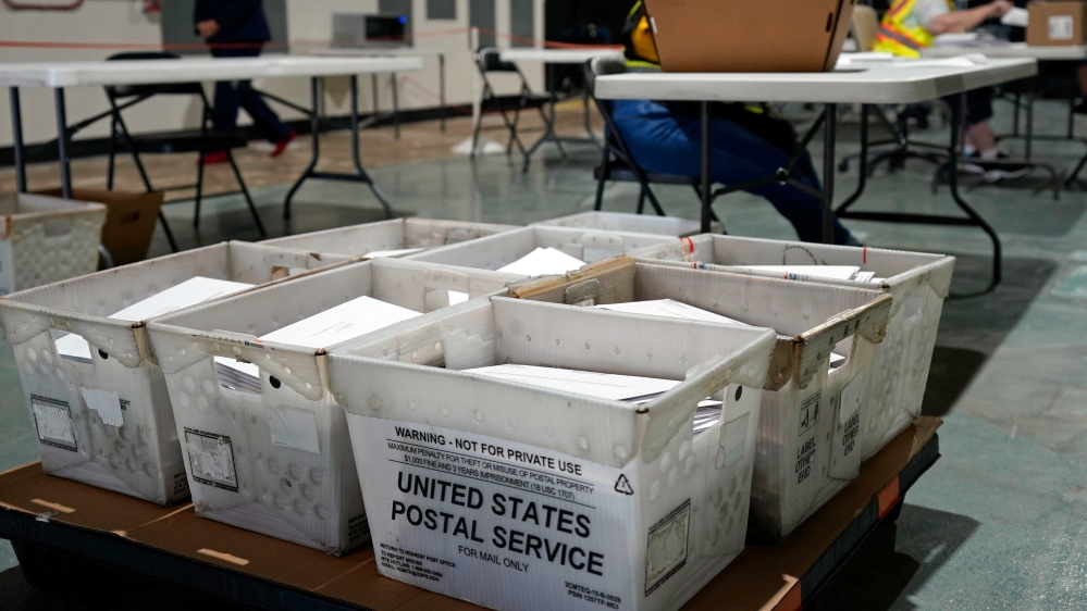 Workers prepare absentee ballots for mailing at the Wake County Board of Elections in Raleigh, North Carolina