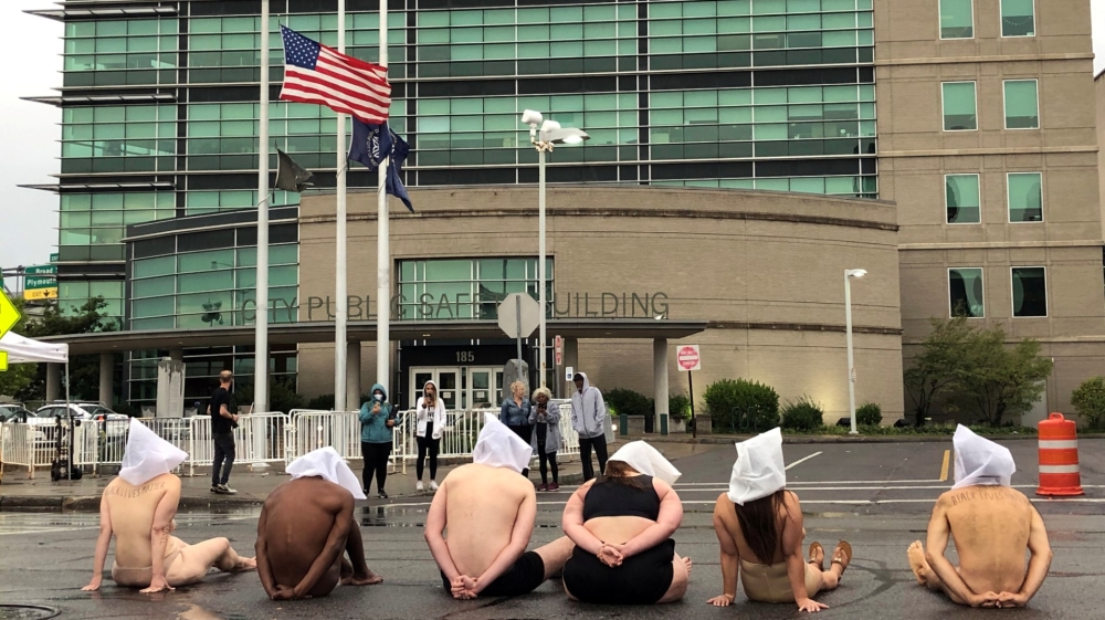 Naked protesters stage a demonstration to protest the death of Daniel Prude in Rochester