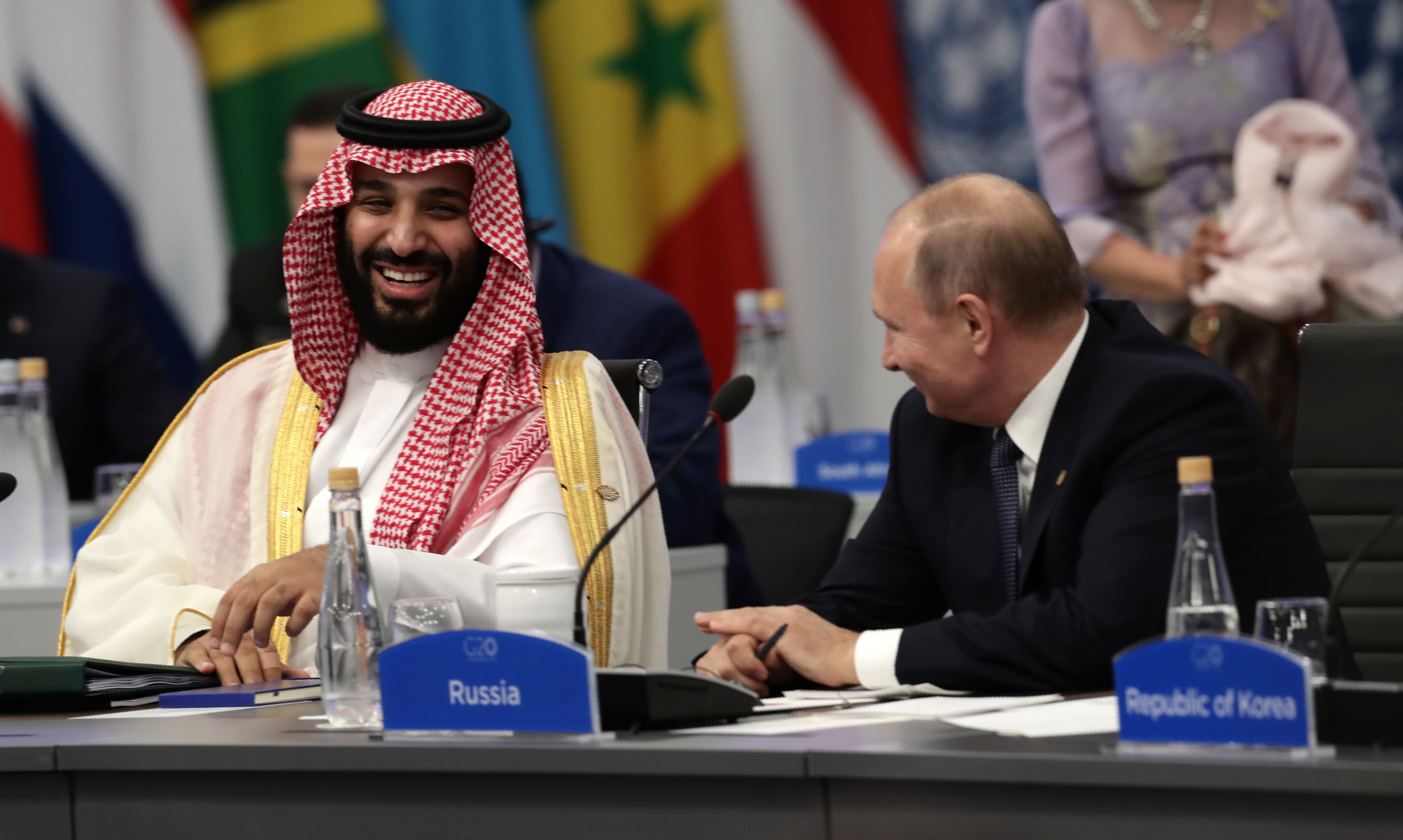 Saudi Arabia's Crown Prince Mohammed bin Salman, left, attends the G20 Leaders' Summit in Buenos Aires with Russia's President Vladimir Putin in 2018 [Alejandro Pagni/AFP]