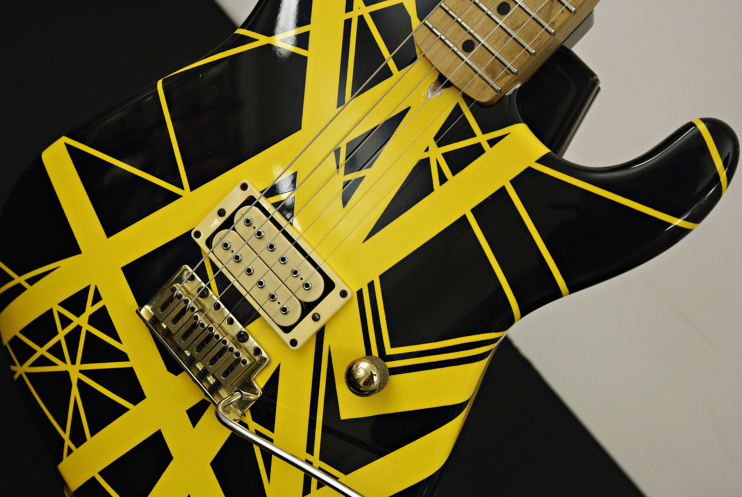 \ A view of Eddie Van Halen’s 1982 Charvel, with signature striped paint scheme, made for, owned by, and played by Van Halen himself, on display during Guernsey’s Celebrity Guitar Auction preview at Bohemian National Hall in 2016
