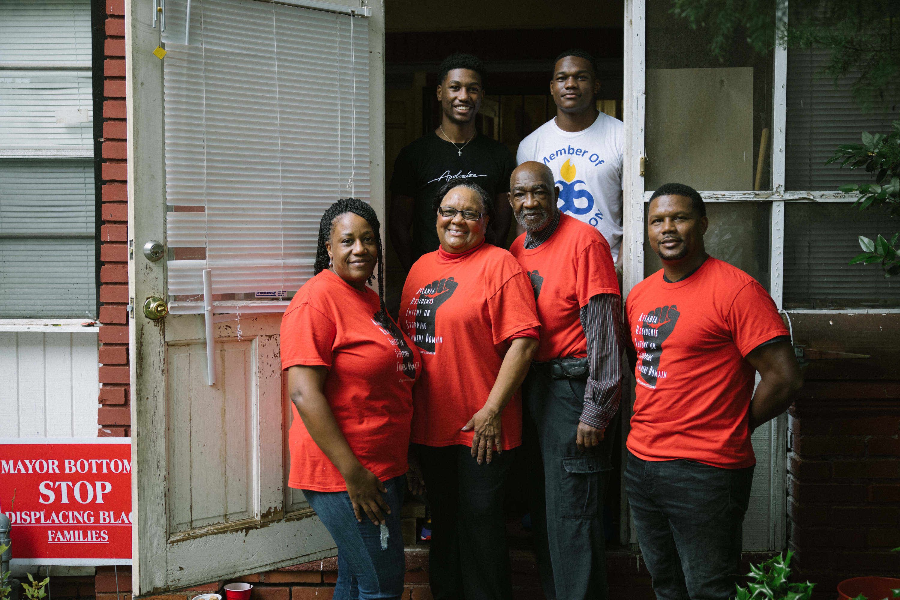 Robert and Bertha Darden with their family in front of their home