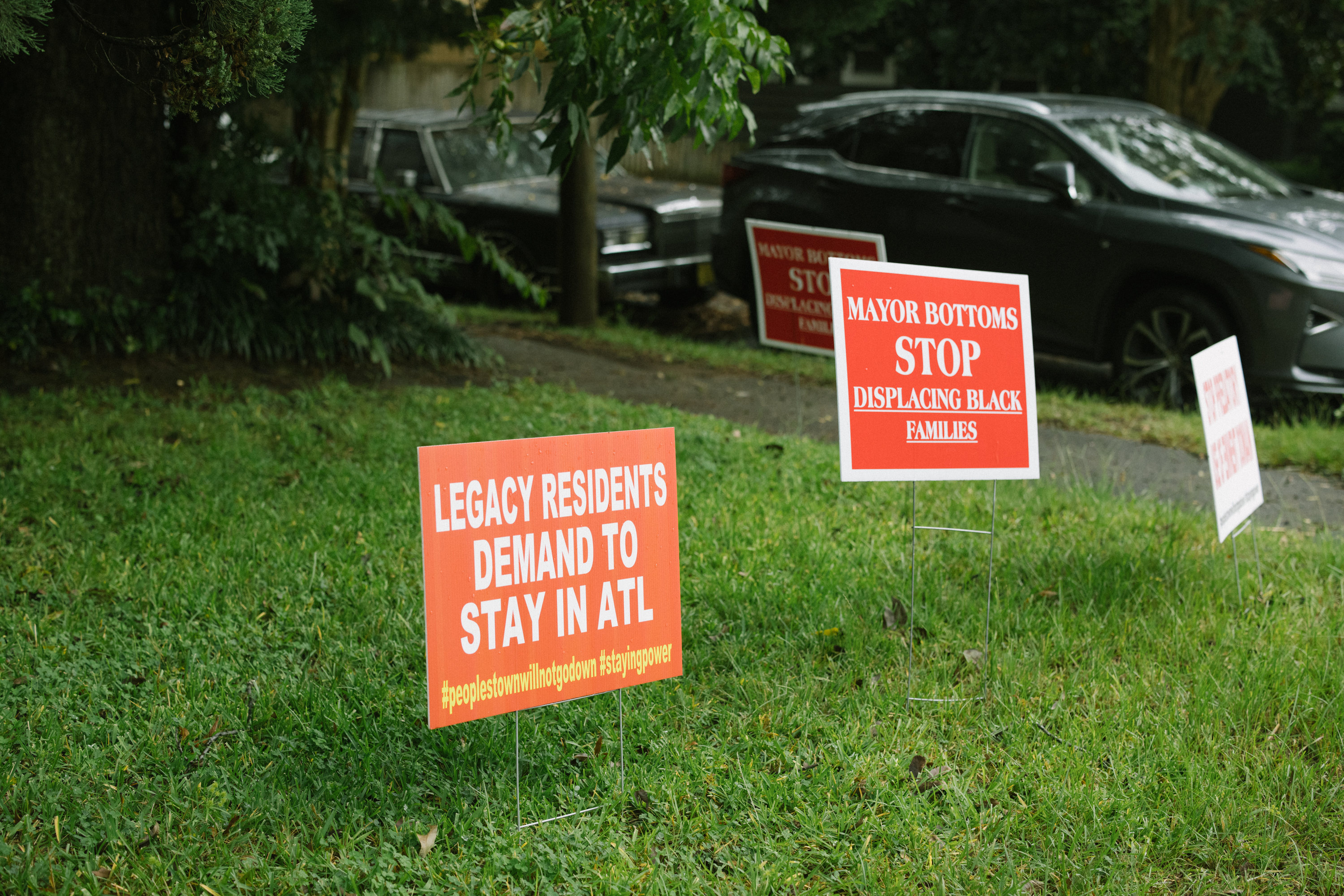 Signs in the front garden of one of the homes still standing on the block