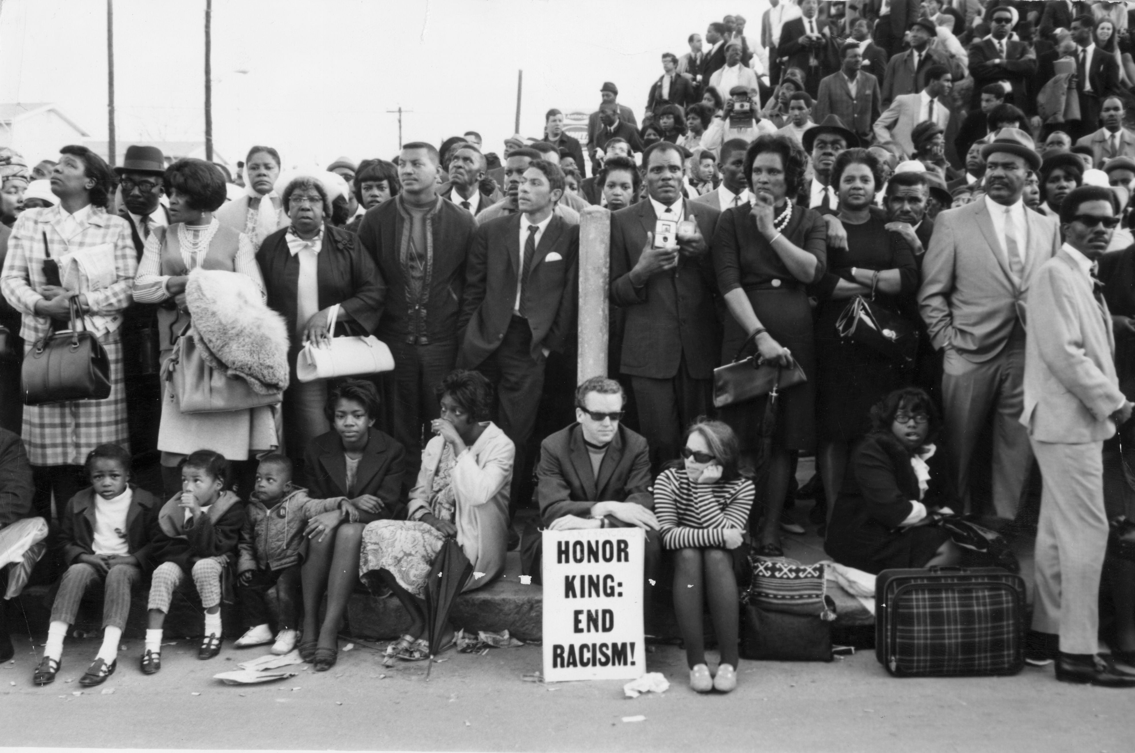 Mourners waiting for Dr Martin Luther King’s funeral cortege to pass outside Moorhouse College in Atlanta, Georgia on April 9, 1968