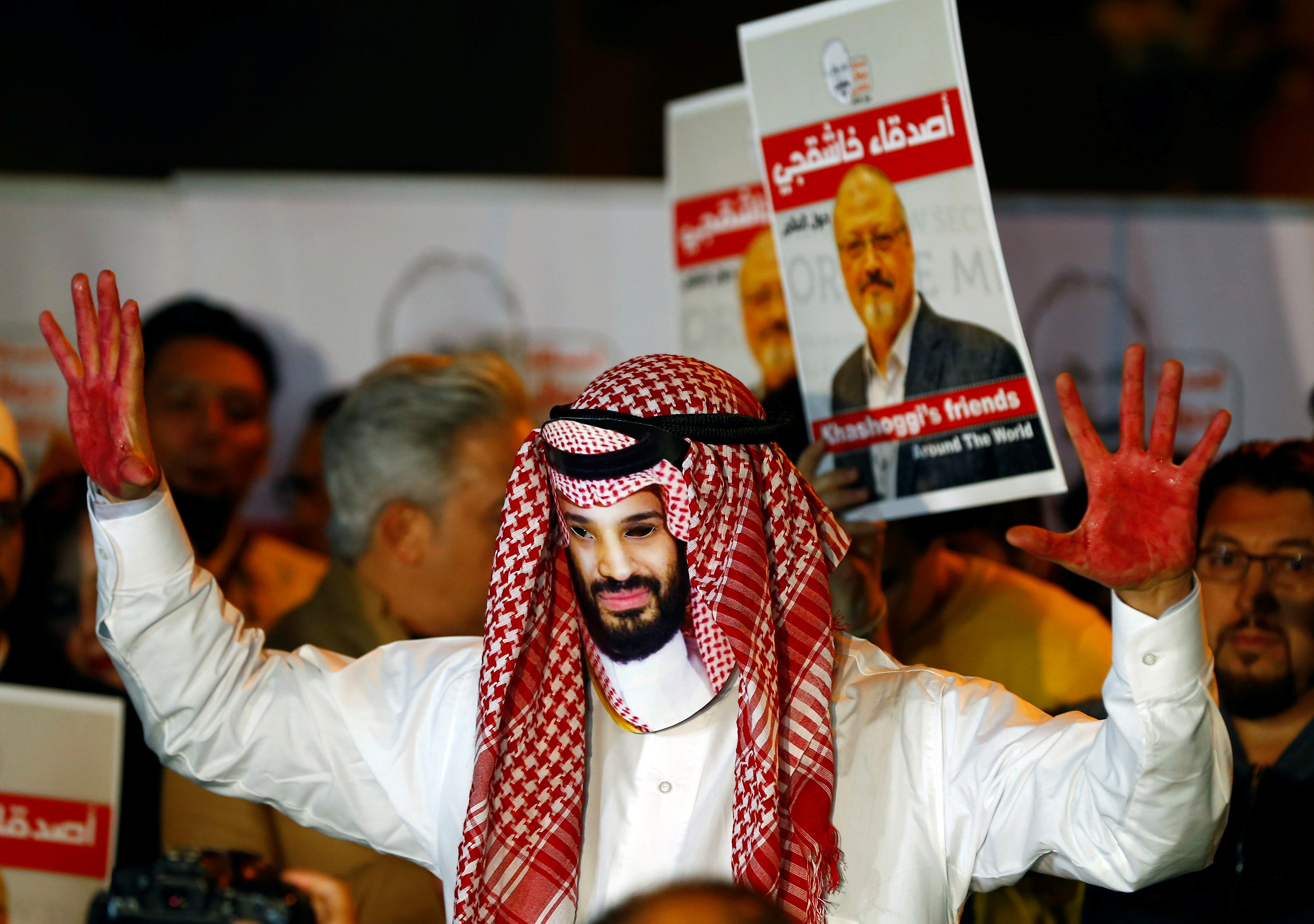 A demonstrator wearing a mask of Saudi Crown Prince Mohammed bin Salman attends a protest on October 25, 2018, outside the Saudi Arabia consulate in Istanbul, Turkey, where Saudi journalist Jamal Khashoggi was murdered [Osman Orsal/Reuters]