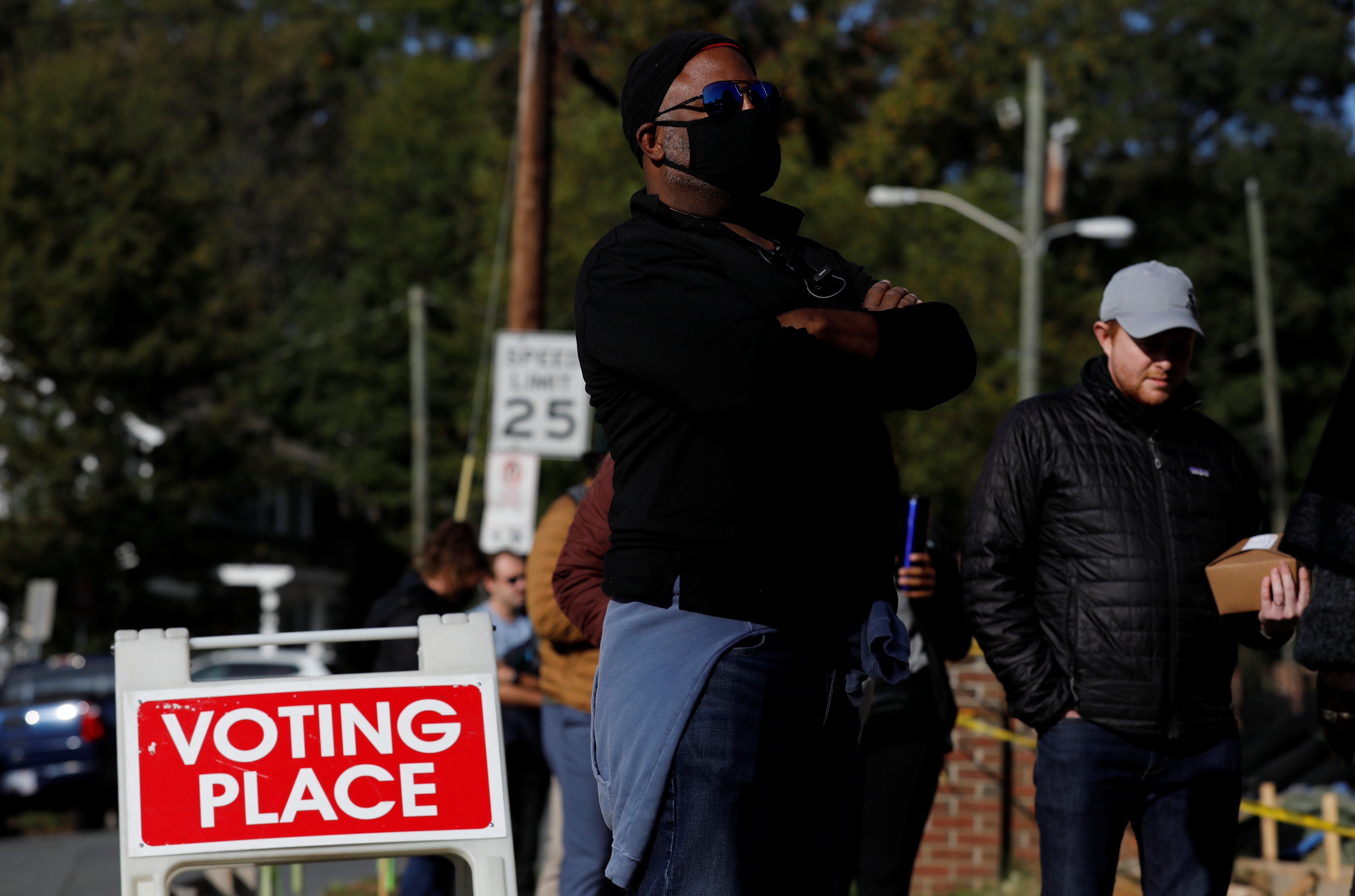 Voters line up at a polling station on election day in Charlotte, North Carolina, United States