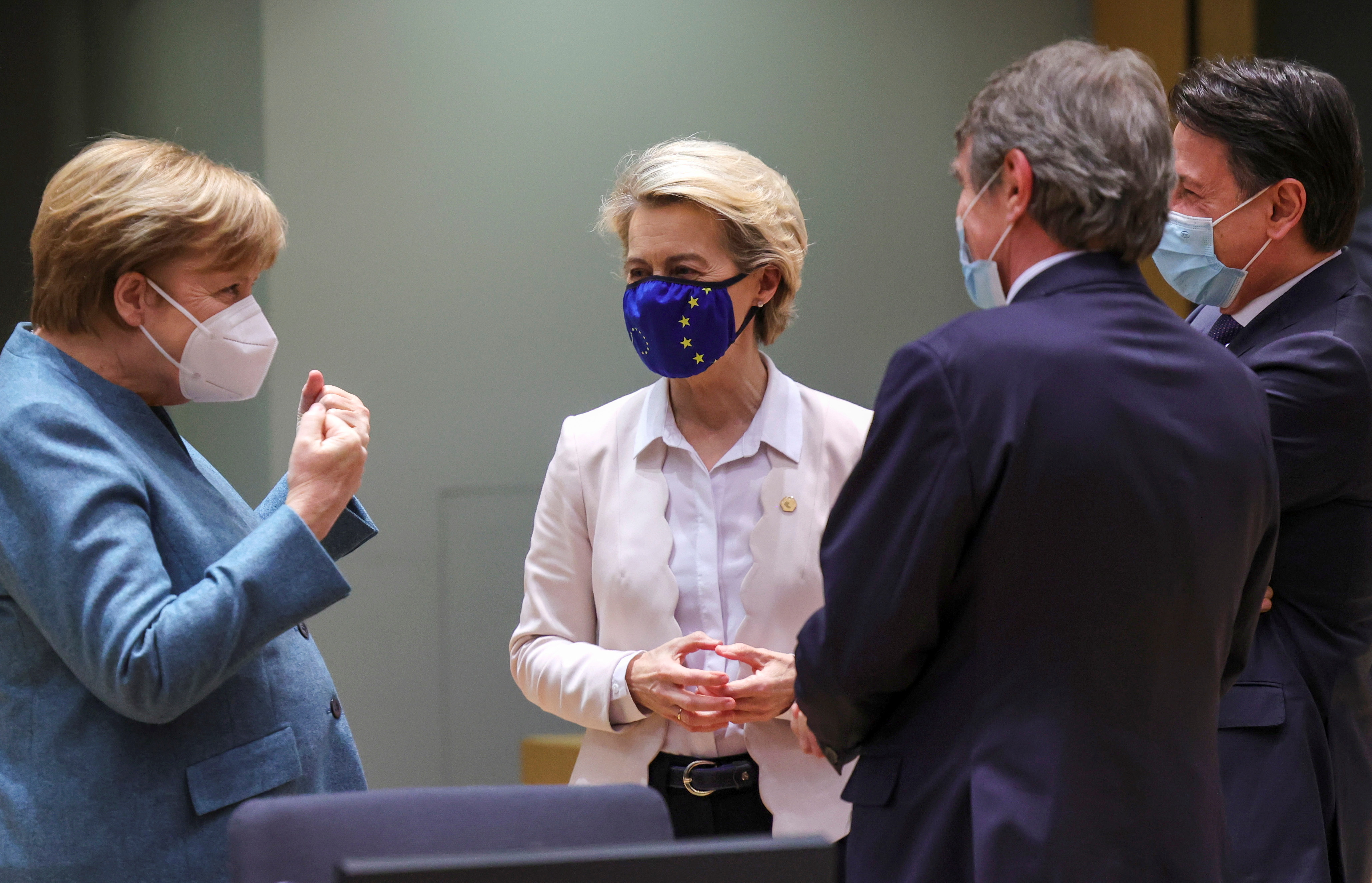 Germany’s Chancellor Angela Merkel speaks with European Commission President Ursula von der Leyen, Italy’s Prime Minister Giuseppe Conte and European Parliament President David-Maria Sassoli during a round table meeting at a face-to-face EU summit amid the coronavirus disease (COVID-19) lockdown in Brussels, Belgium