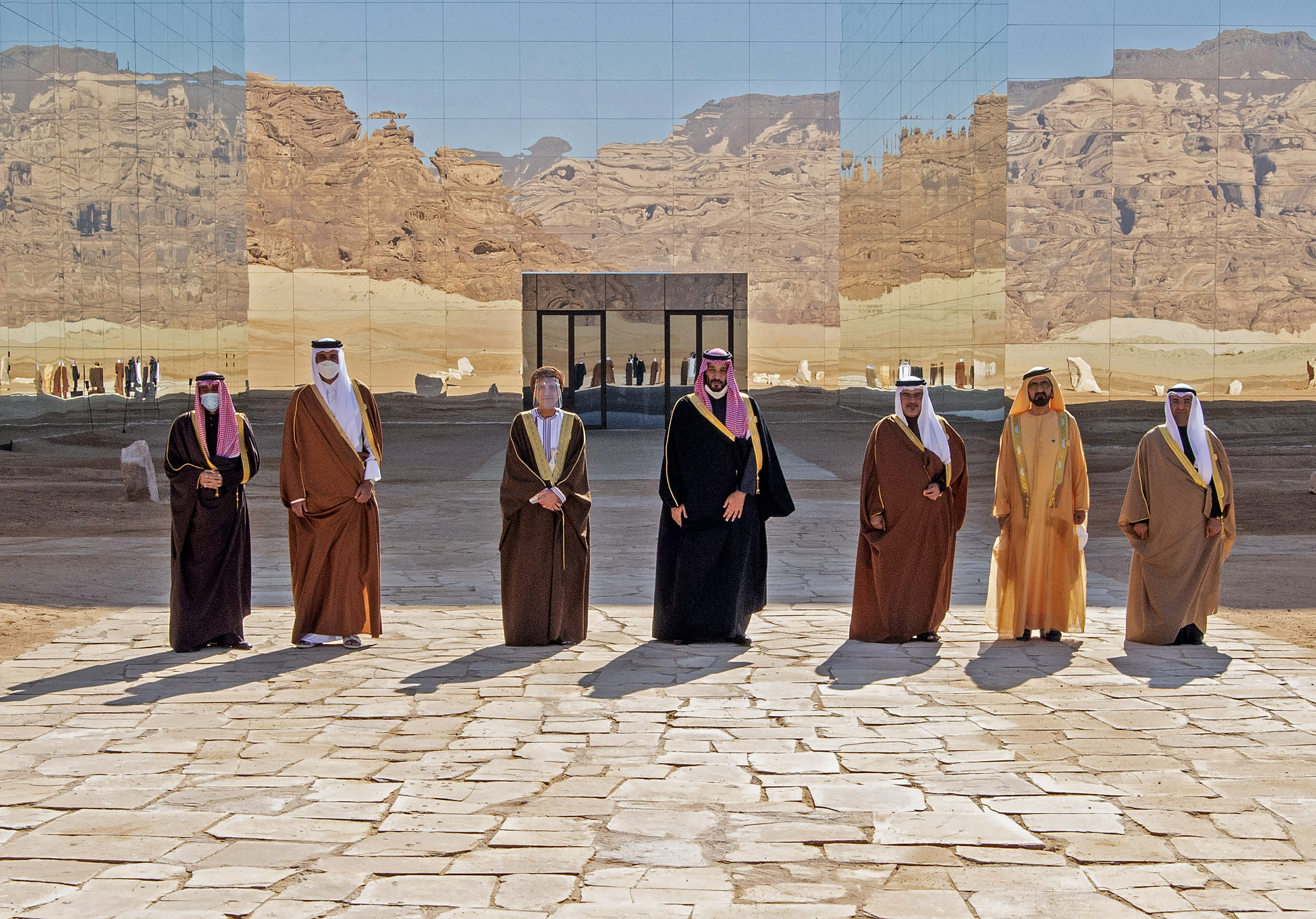 Kuwaiti Emir Sheikh Nawaf al-Ahmad Al-Sabah, Emir of Qatar Tamim bin Hamad Al-Thani, Omani Deputy Prime Minister Fahd Bin Mahmud, Saudi Crown Prince Mohammed bin Salman, Bahrain's Crown Prince Salman bin Hamad Al-Khalifa, Dubai's Ruler and UAE Vice President Sheikh Mohammed bin Rashid Al-Maktoum and Nayef al-Hajraf, secretary-general of the GCC pose for a picture before the opening session of the GCC summit in the northwestern Saudi city of al-Ula on January 5, 2021 [File: Bandar al-Jaloud/Saudi Royal Palace via AFP]