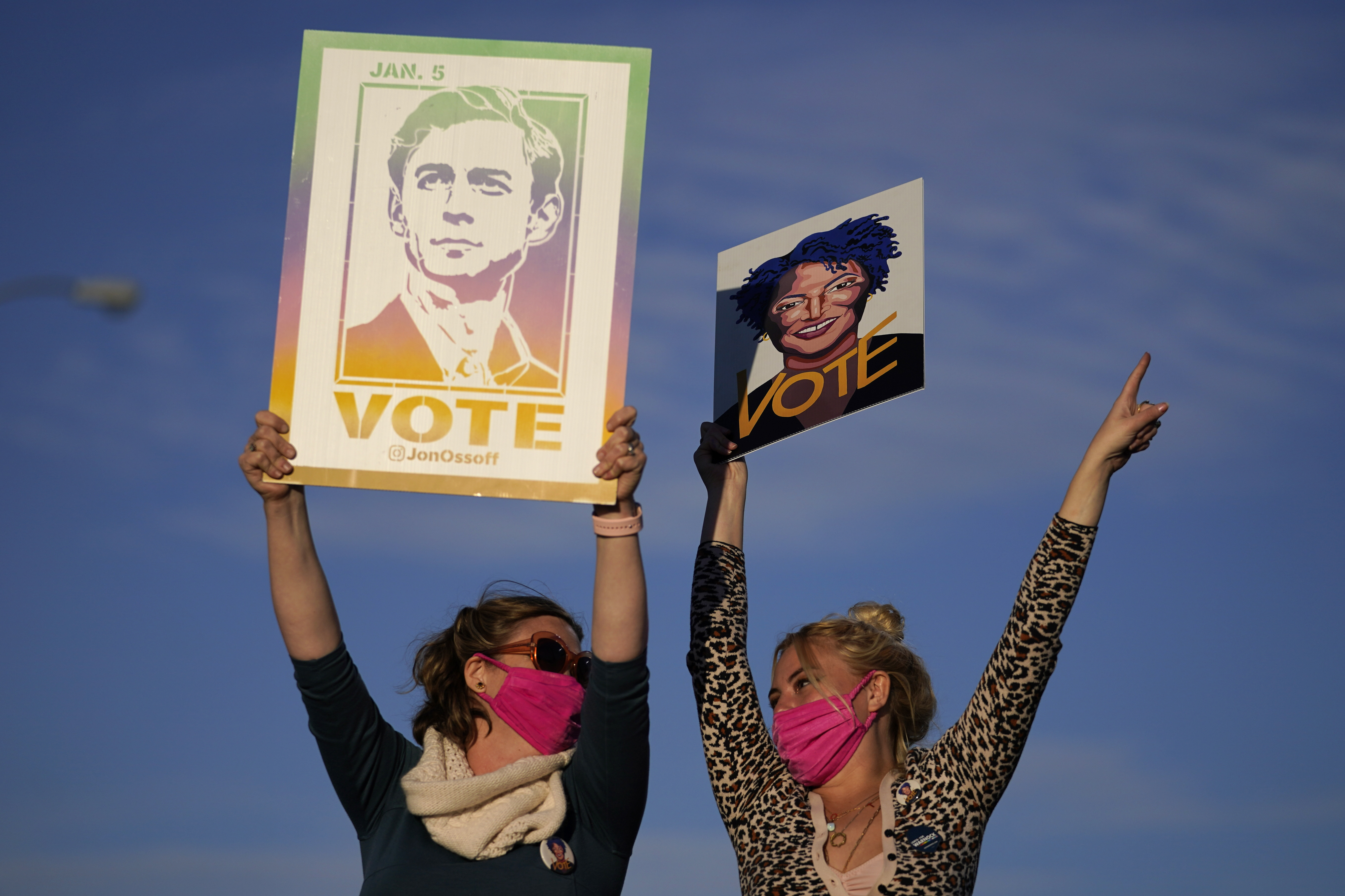 Supporters cheer as President-elect Joe Biden speaks in Atlanta in a get-out-the-vote rally for Senate candidates Raphael Warnock and Jon Ossoff.