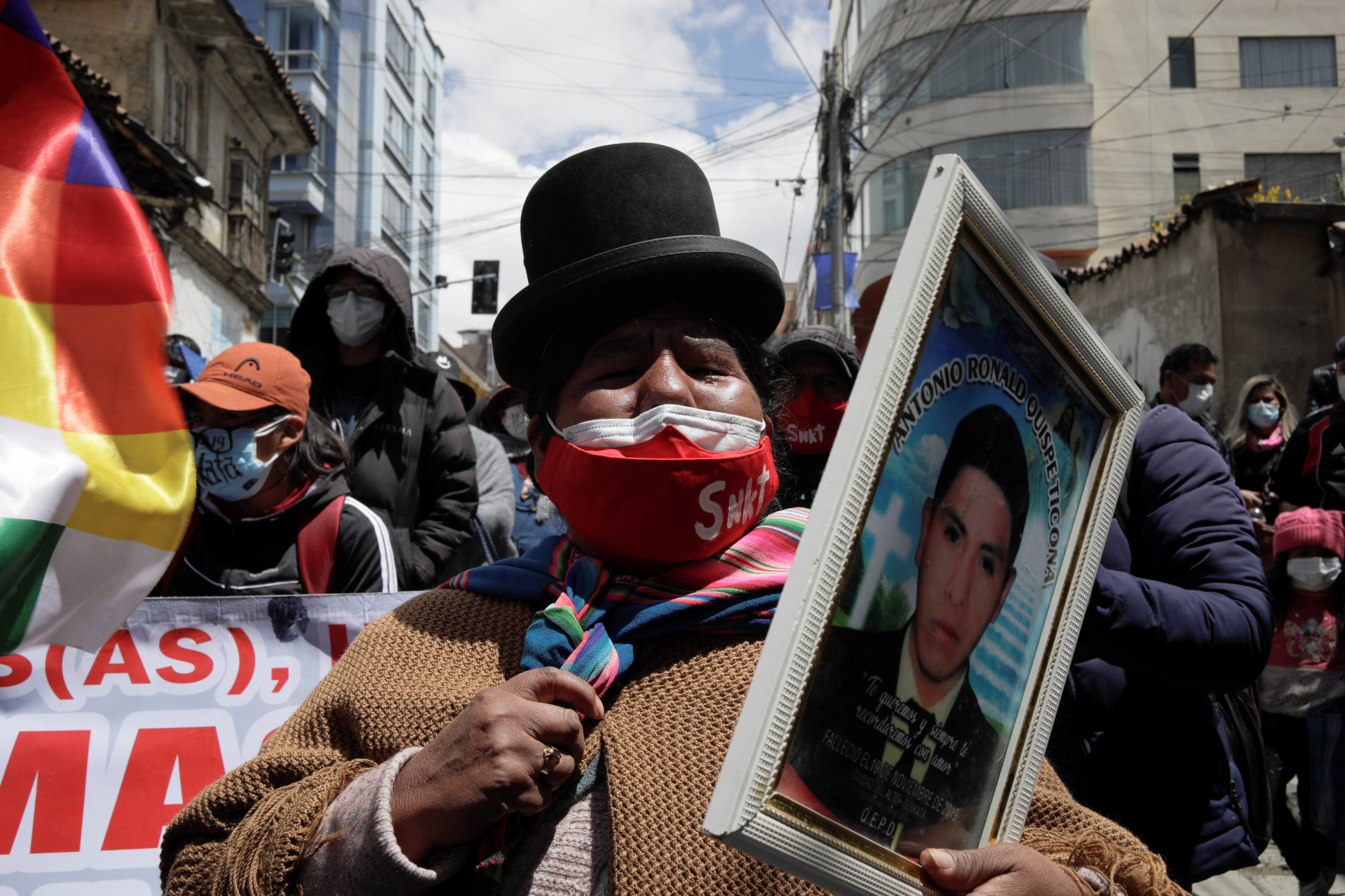 Demonstrators protest in front of the FELCC (Special Force to Fight Against Crime) headquarters to demand jail for former interim President Jeanine Anez in La Paz, Bolivia on March 14, 2021
