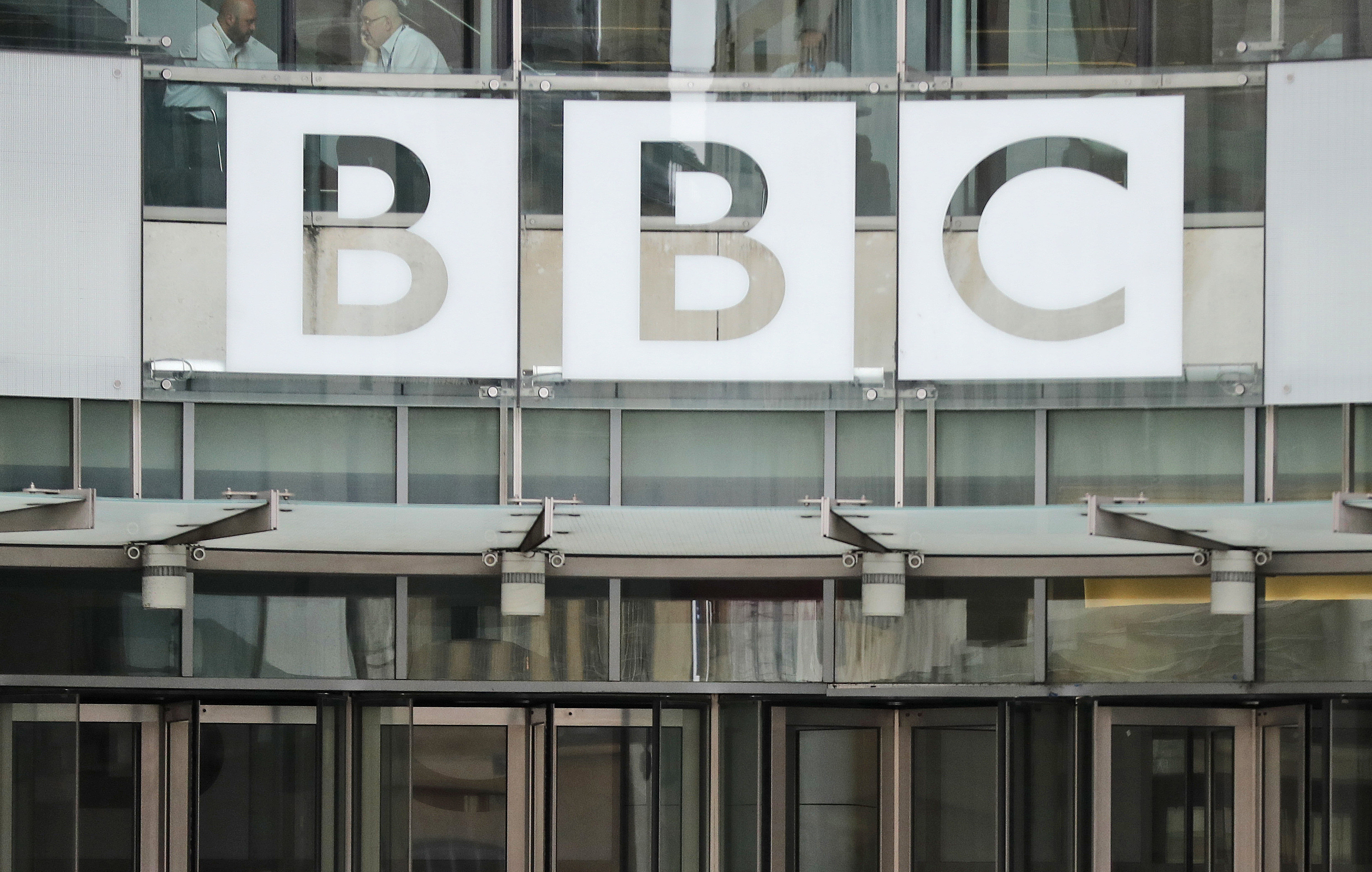 In this file photo dated Wednesday, July 19, 2017, The BBC sign outside the entrance to the headquarters of the publicly funded media organisation in London.