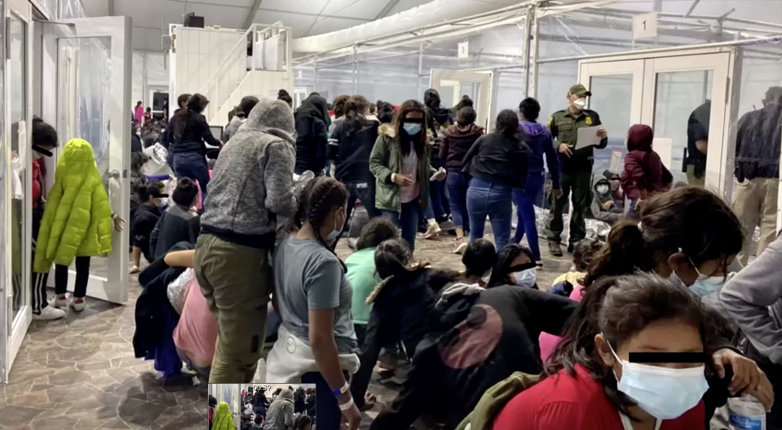 Photos released on Monday show migrants crowded into holding areas separated by plastic sheeting at a temporary processing centre near the US-Mexico border [US Representative Henry Cuellar via Reuters]