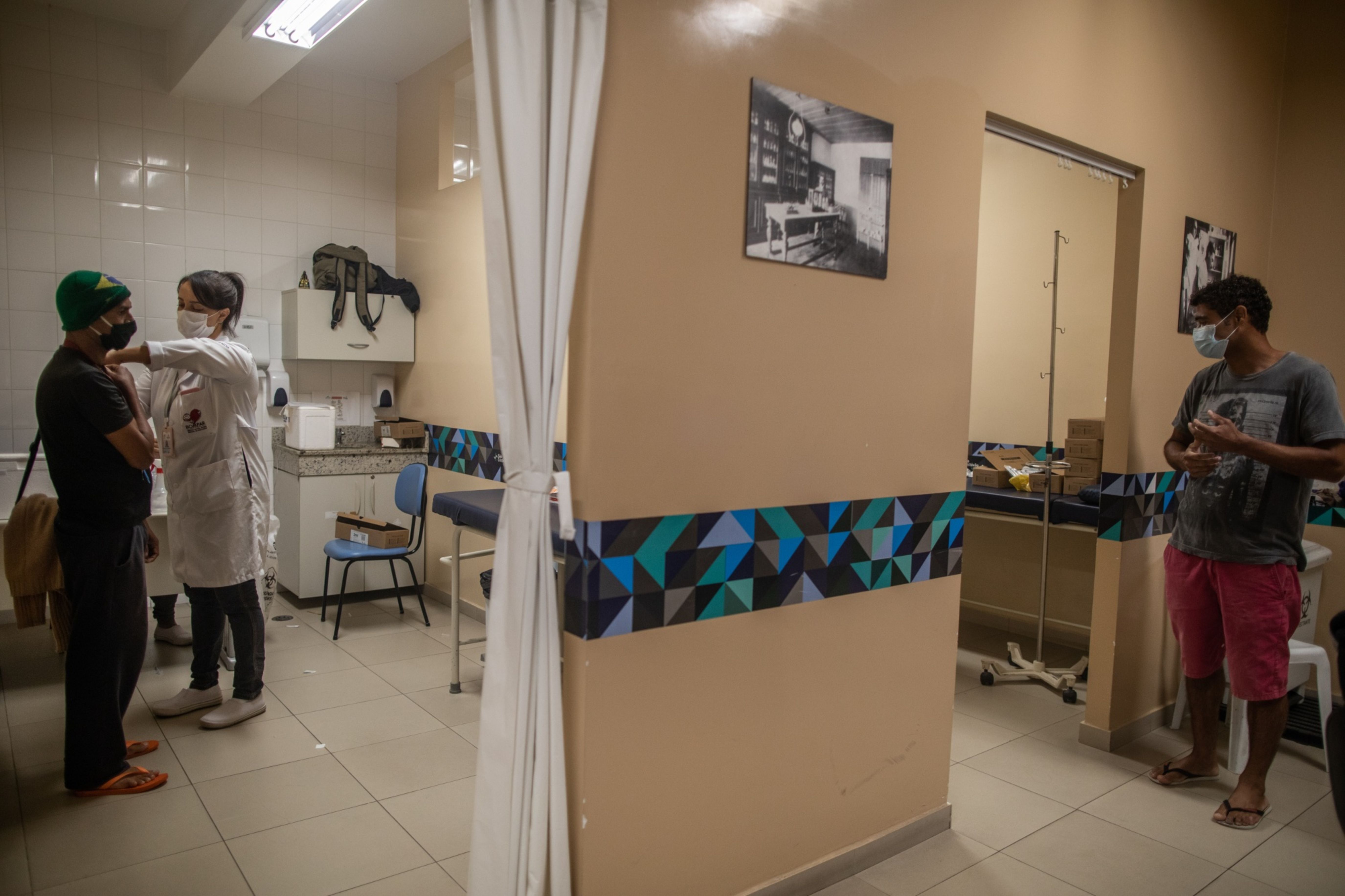 A healthcare worker administers a dose of the Sinovac Biotech CoronaVac COVID-19 vaccine to a person in Sao Paulo [Bloomberg]