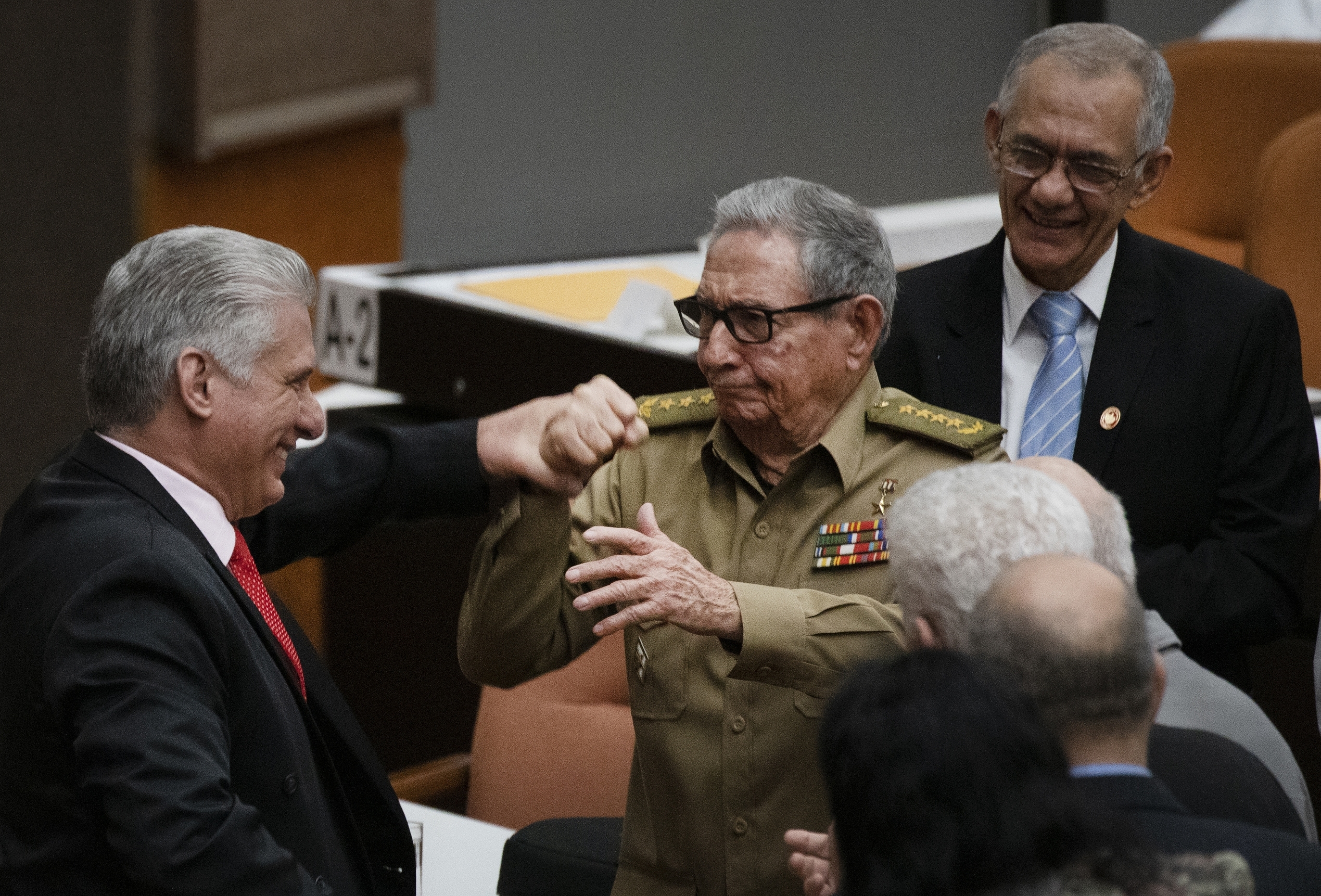 Investors, analysts and Cuban citizens will all be watching this weekend's congress closely — and seeing how many more of the country's so-called 'historic generation' actually depart, as Raul Castro (centre) has. That, experts say, will be crucial to knowing whether economic change is actually in the cards or whether business will continue as usual [File: Ramon Espinosa/AP Photo]