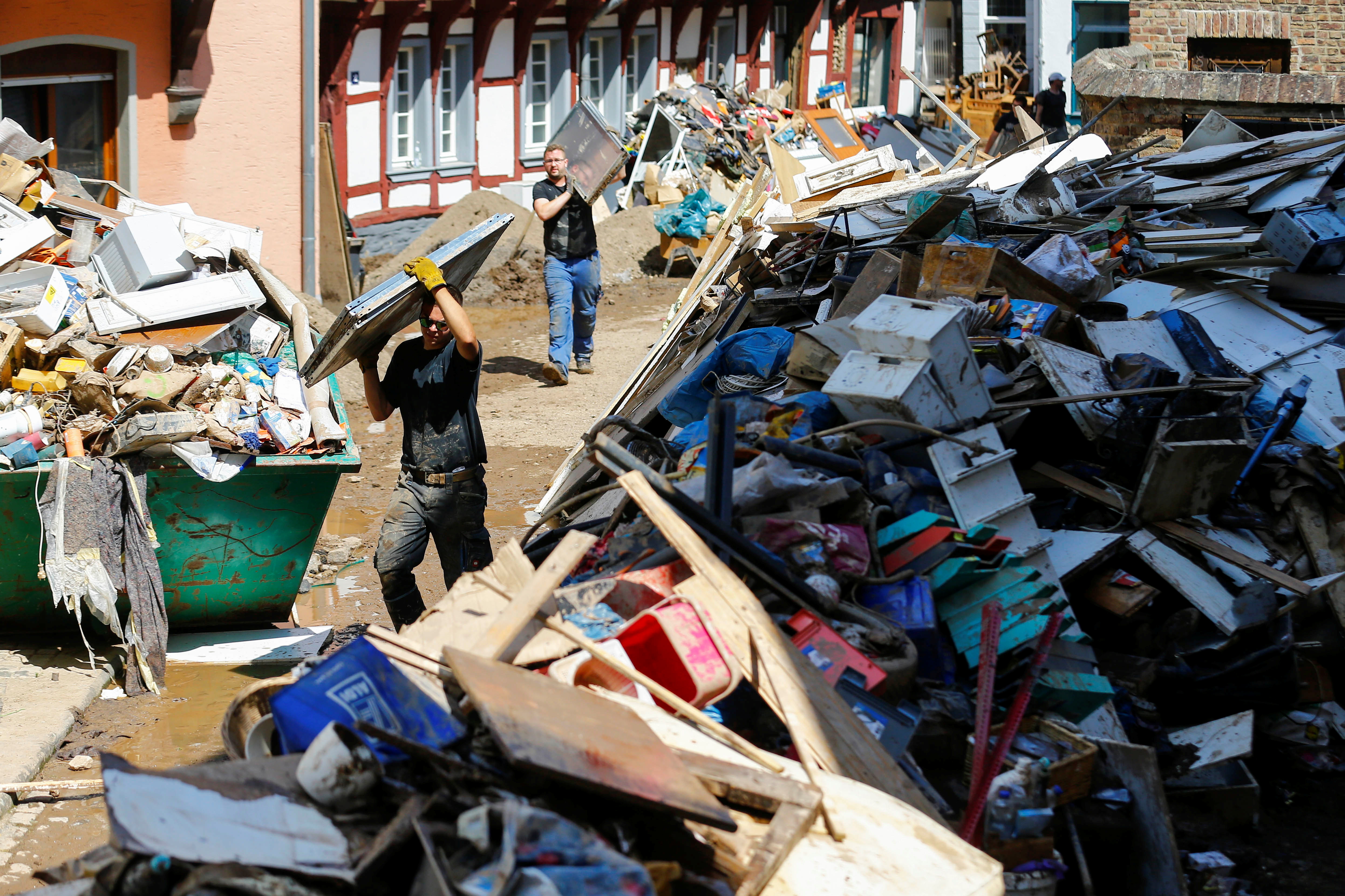 People work in an area affected by flood in the centre of Bad Muenstereifel, Germany