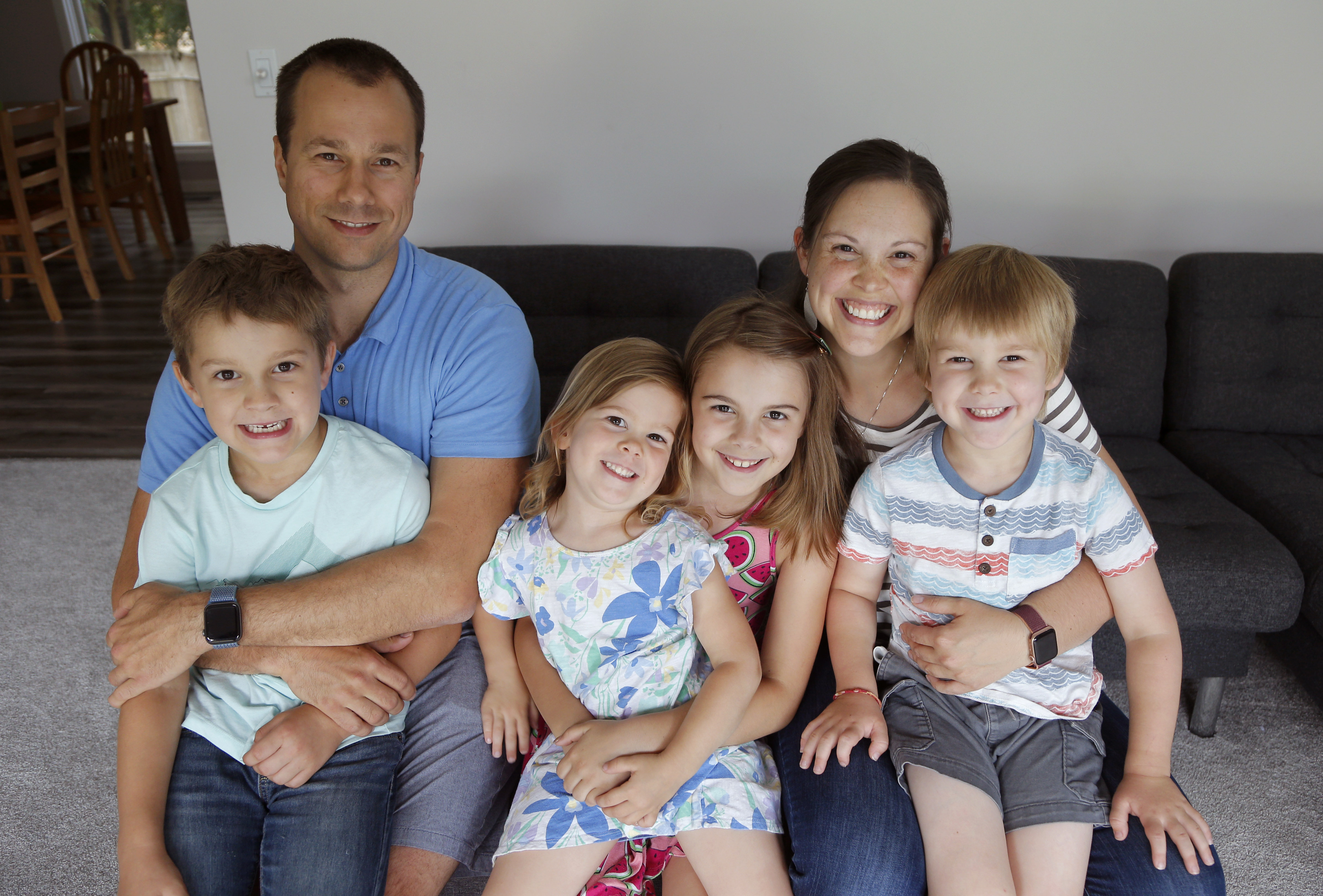 Chris and Kristen Umphlett and their children, from left, Derek 7, Elsie, 3, Kyria, 9, and Hudson, 5, in their home in East Lansing, Michigan, the US