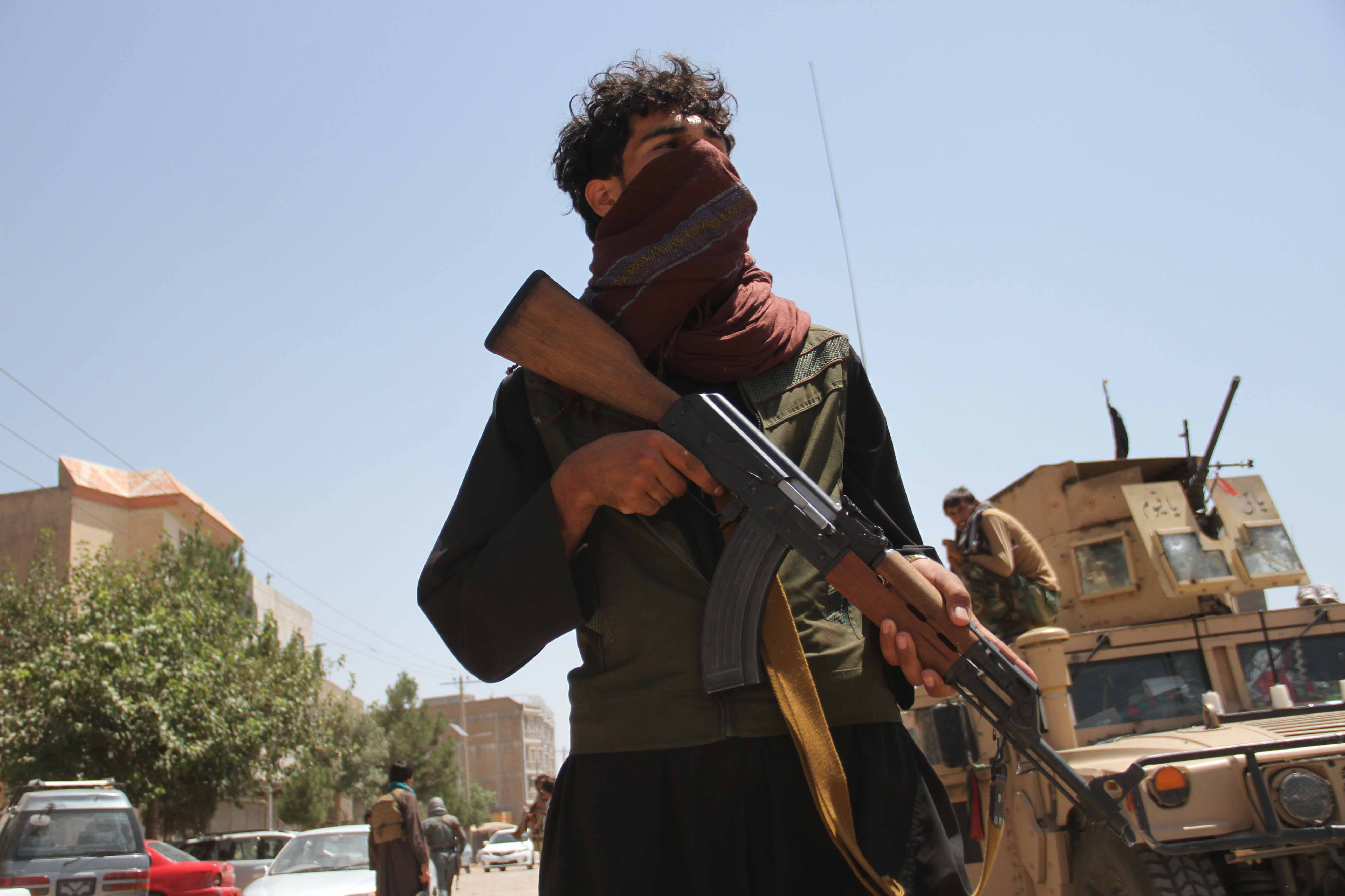 A fighter loyal to a former mujahideen commander patrols after security forces took back control of parts of Herat city, Afghanistan [Jalil Rezayee/EPA]