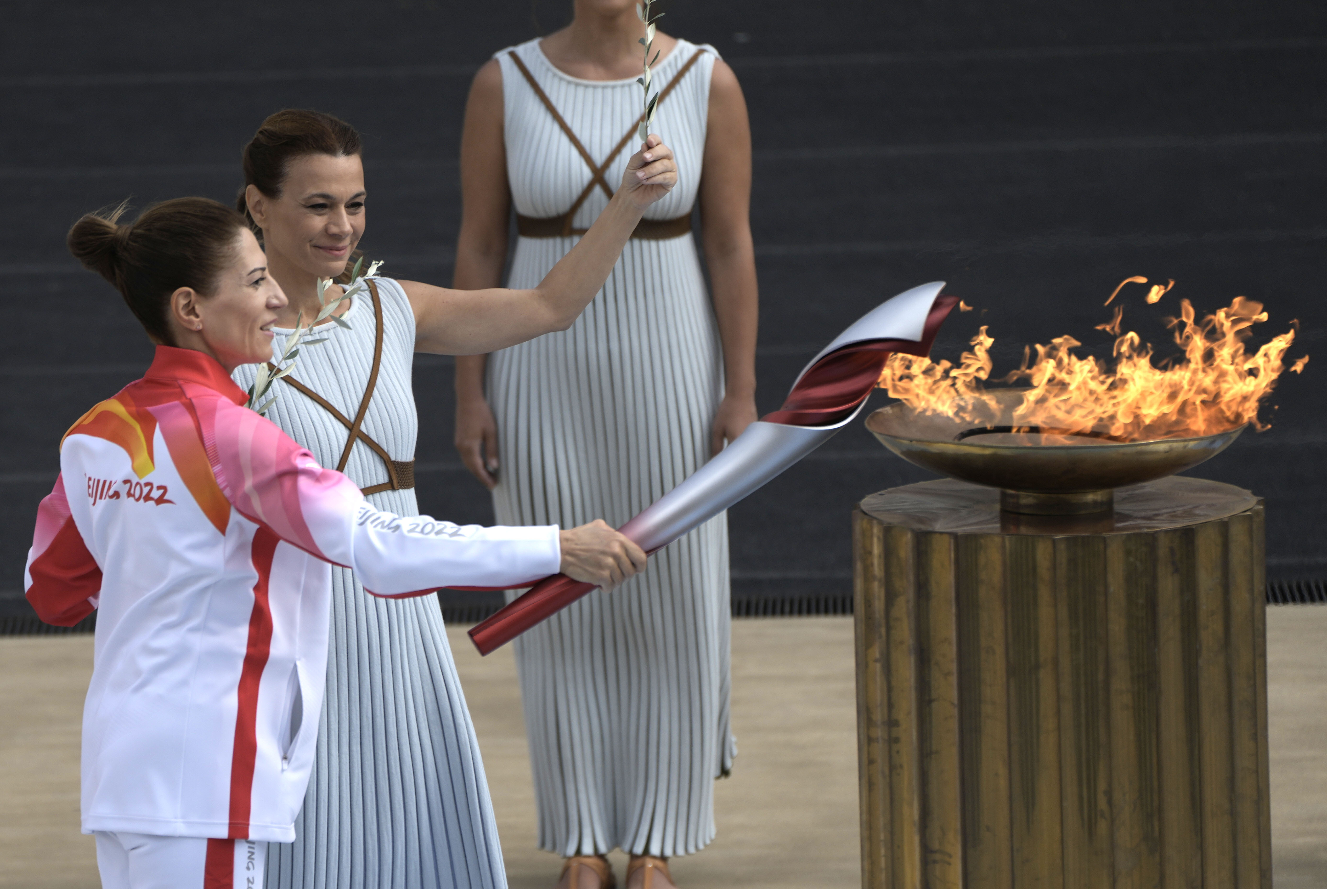 Greece’s Olympic Cross Country Ski Champion Paraskevi Ladopoulou lights the flame during the Olympic flame handover ceremony at Panathinean stadium in Athens, Greece, October 19, 2021